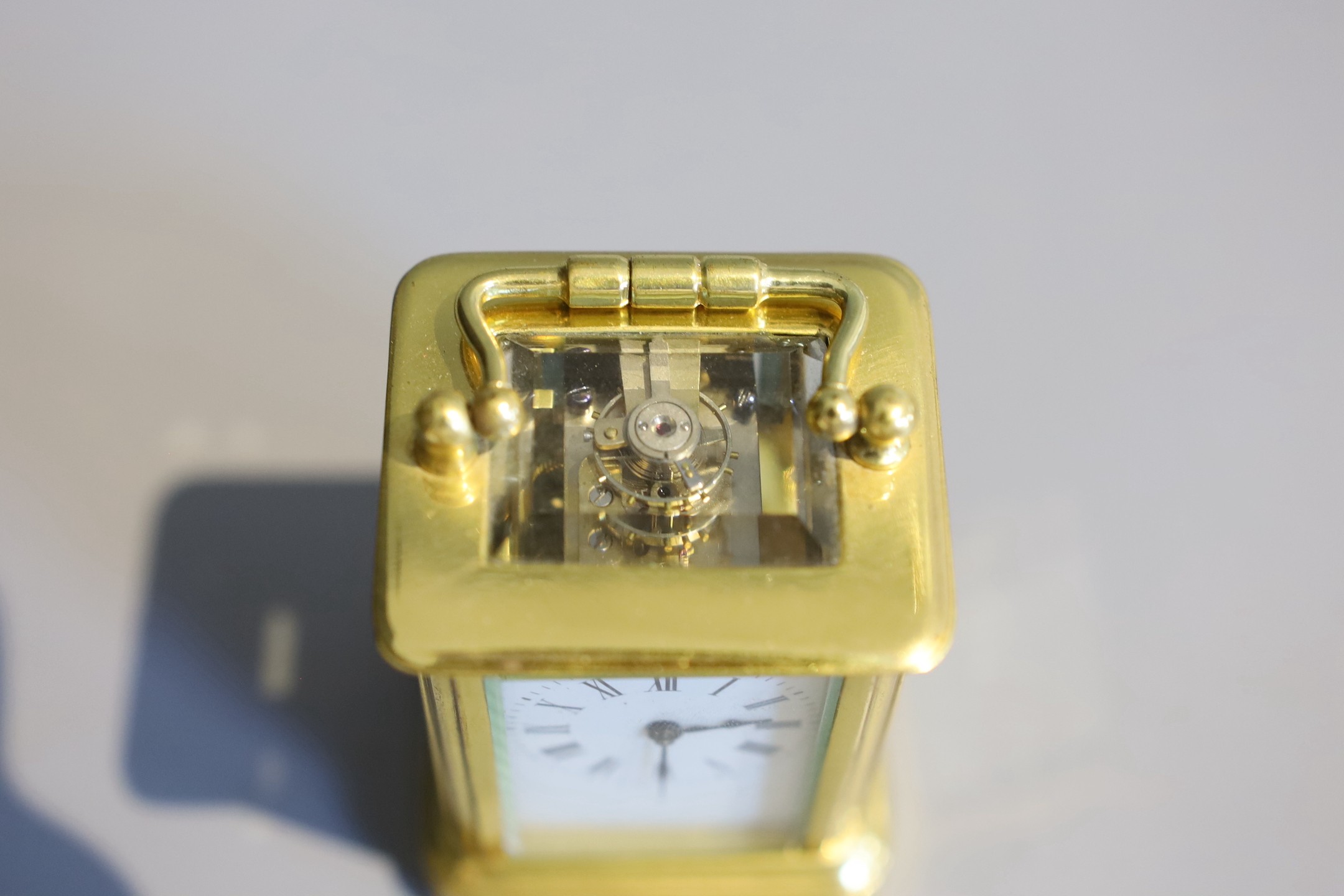 A 19th century French lacquered brass miniature carriage timepiece, height 7cm